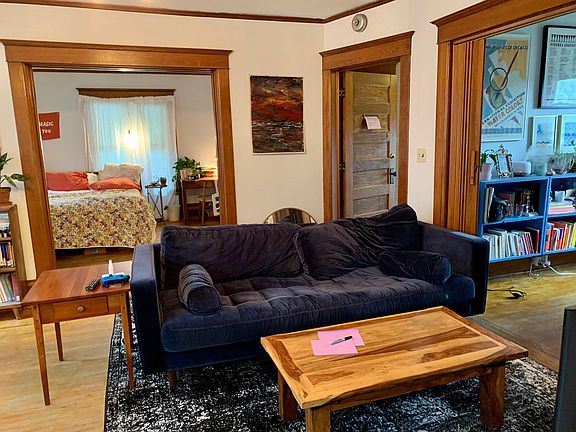 Living room with bedroom at rear, office at right, door to front hallway at right corner
