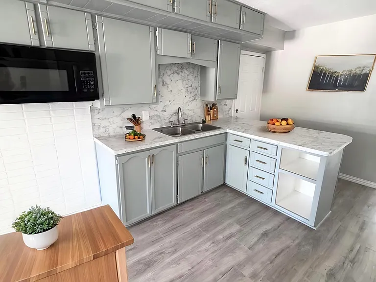 Staged kitchen. Newly painted cabinets.