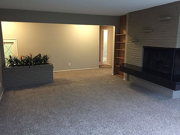 Living room w/ corner FP