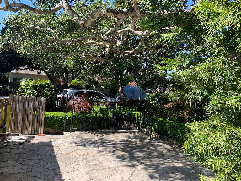 Spacious front court yard with mature oak trees - perfect for lounging and great for entertainment