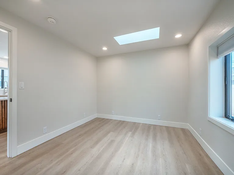 Bedroom #2 , closet organizers w/ 2 skylights and large window.