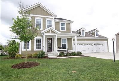 Welcome to your new home with a covered front porch and 3 car garage