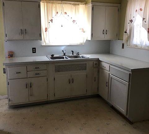 Lot of cabinets and lots of lighting in kitchen