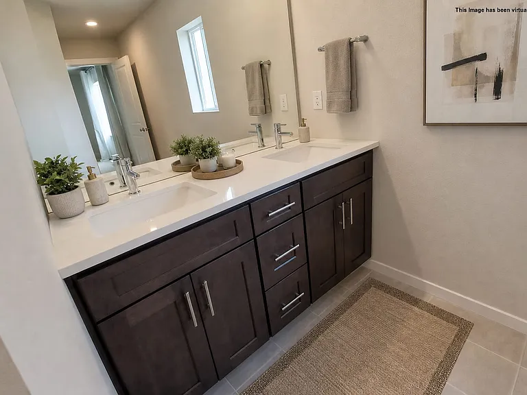 Primary Bathroom double sinks, virtually staged.