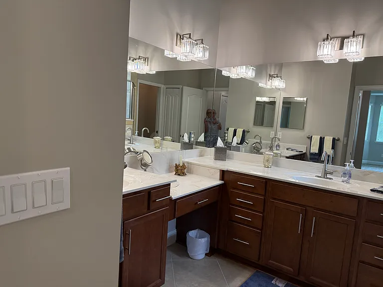 Master bathroom. 2 sinks and a makeup area. Again, top of the line crystal lighting and Moen fixtures recently installed.
