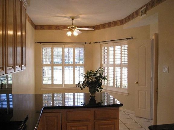 Breakfast area has shutters to let the sun shine in