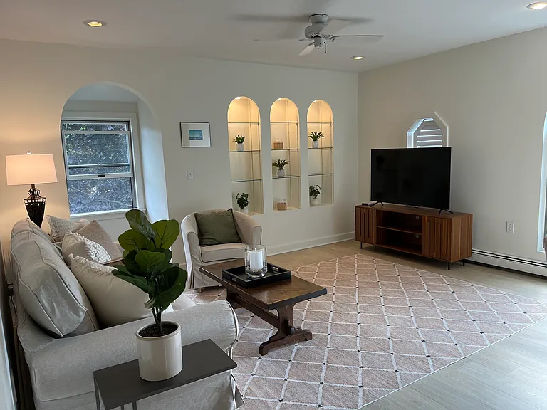 New carpet and flooring in living room plus new Smart Roku tv with free wireless means easy access to your favorite entertainment & services .