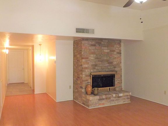 Living room has a wood burning fireplace