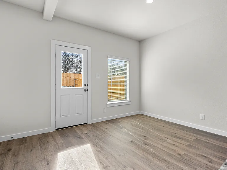 The dining room has large windows that let in great, natural light.