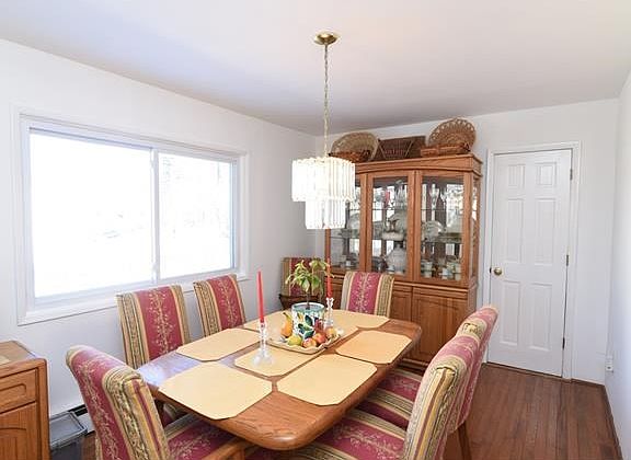 Formal dining room overlooks backyard.