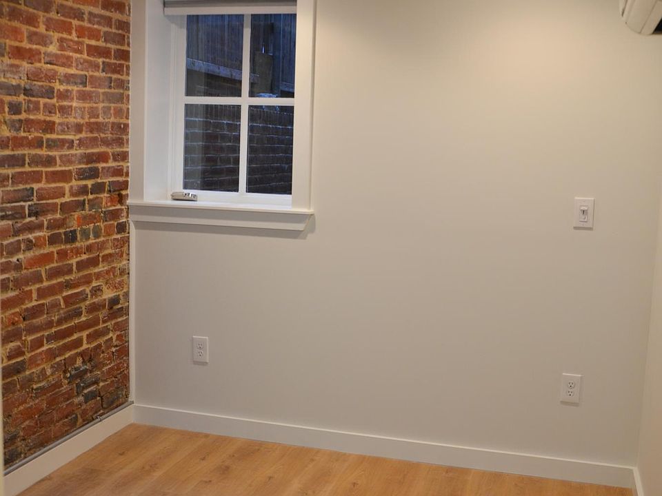 Exposed brick in the bedroom