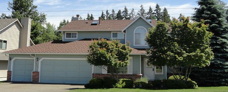 Timeless brick and cedar captured under a 50 year roof. Special Sherman Williams durable, washable paint. Beautiful easy to maintain landscaped gives privacy and has both front and backyard sprinkler system.