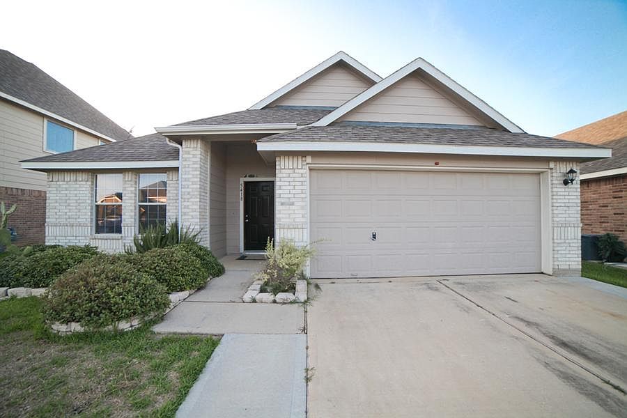 2 Car Garage with Opener. Also driveway has extensions on e