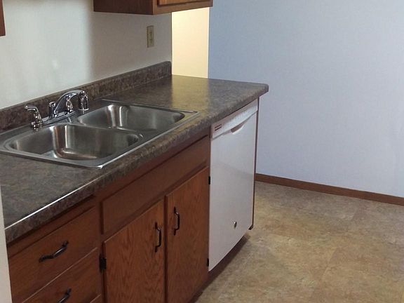 Kitchen with stove and refrigerator on the opposite side of