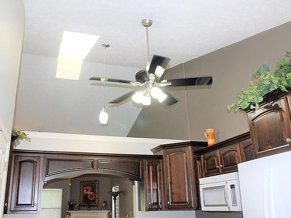 Kitchen showing the ceiling fan and sky light.