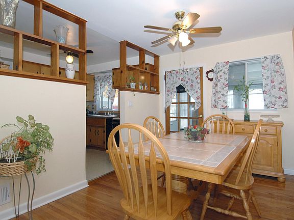 dining room with door to 3 season porch