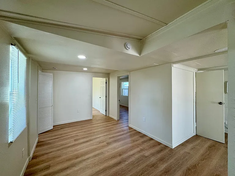 View from dining room to the secondary and primary bedrooms.
