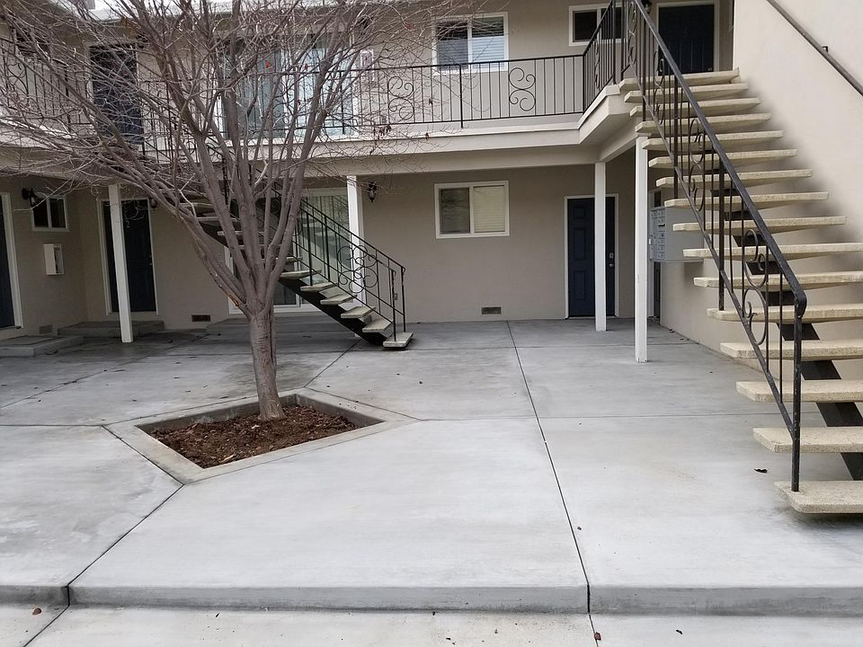 Courtyard showing front doors to apartments (up and down)