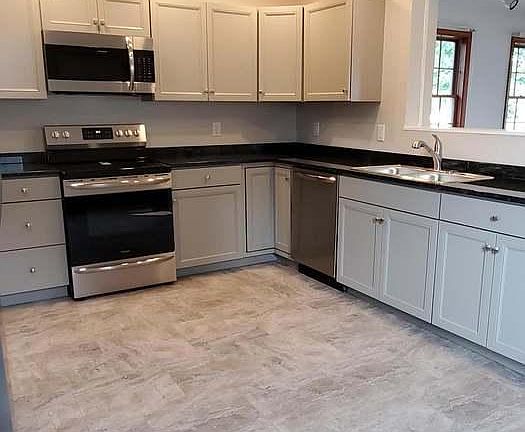 New kitchen with all new appliances and basement access.
