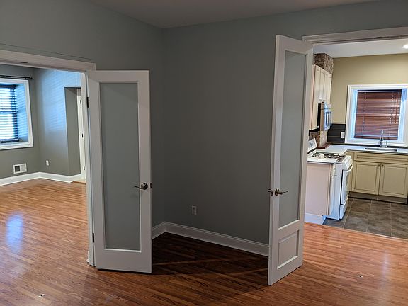 View of kitchen and living room from office/dining room