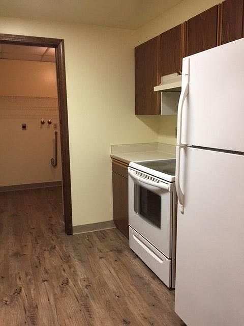 Kitchen that leads to laundry room