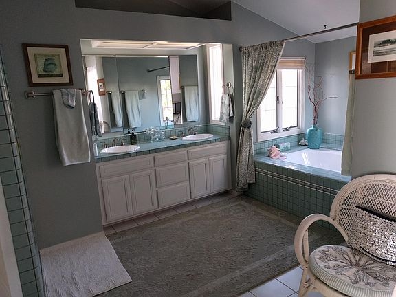 Upstairs master suite includes separate shower and tub, dressing table, bidet and large walk-in closet