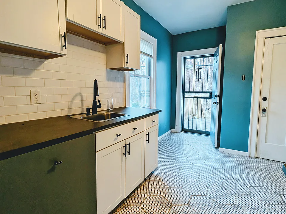 Kitchen from dining room, porch in rear