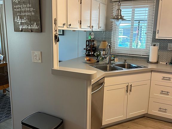 Kitchen - all stainless steel appliances and new lower cabinets with roll-out shelving