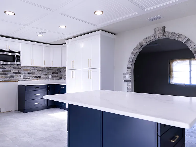 Kitchen with ample storage and built in dining table island.