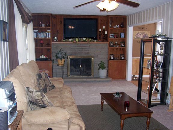 Family room has fresh paint and new carpet.