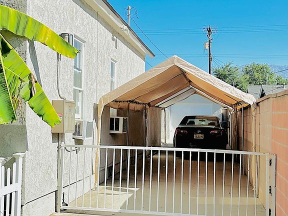 Secured gated driveway w/ shared covered parking