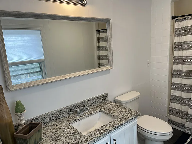 Bathroom- granite, huge mirror, well lit.