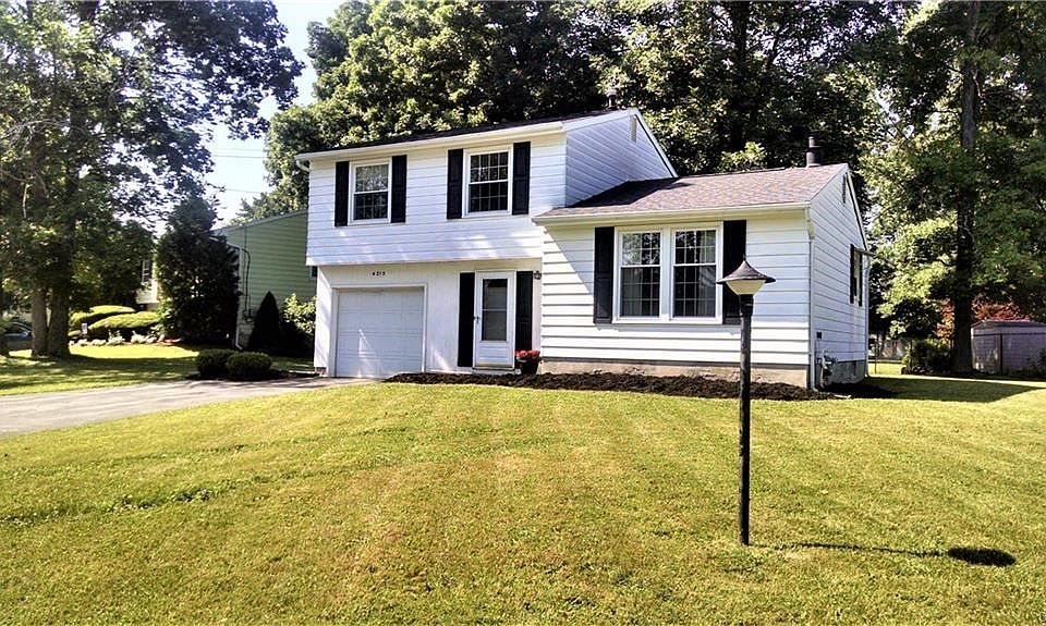 Front of home with all new vinyl shutters and Comfort windows.
