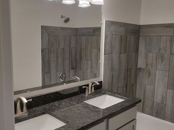 Bathroom with separate sinks and nice storage