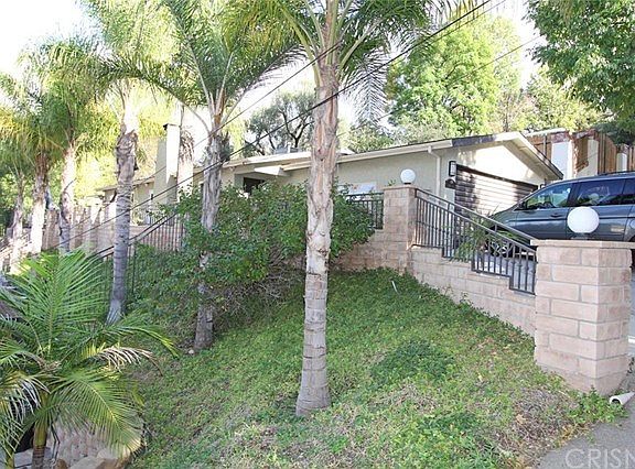Elevated portion of the lot overlooks the main house and lus