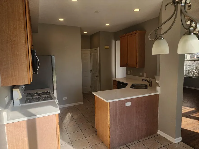 Updated Kitchen with Quartz countertops and recessed LED lighting