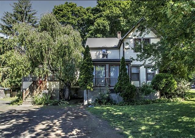 Apartment has private entrance and parking, shown on left.