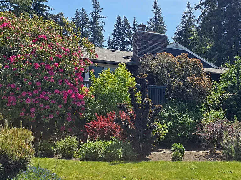 Serene, private grounds with mature landscaping.