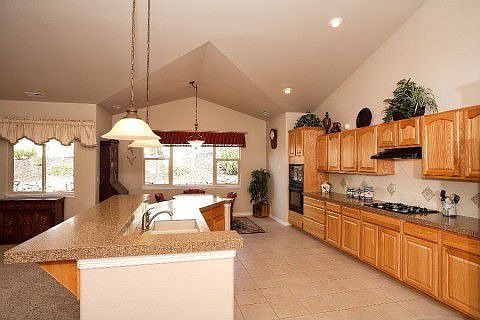 Gourmet kitchen with Corian counters and plenty of cabinets