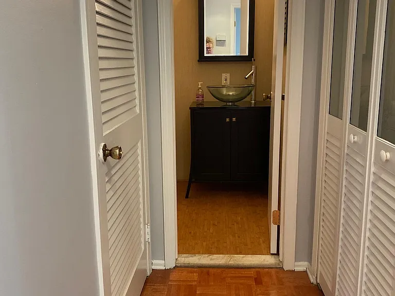 Hallway access to furnace/hot water service/storage and linen closet