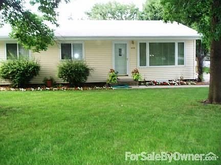 Summer Front View with Egress : Egress window added so we had to remove the bush in front of the hou