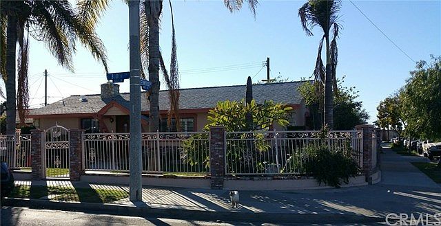 Spacious Corner Lot with Fenced yard. City sidewalks and street lights. Lots of palm trees for that 