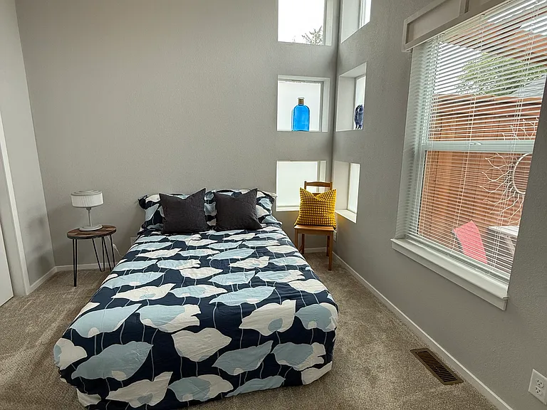 bedroom with lots of windows