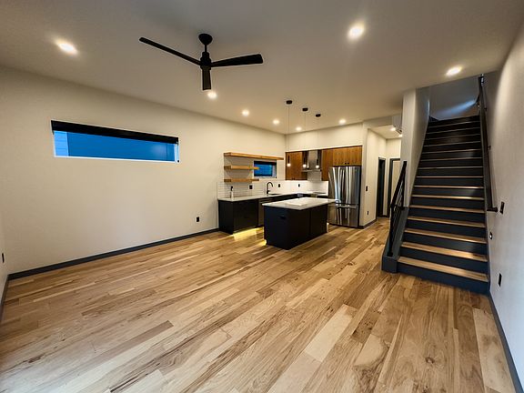 Looking back towards the kitchen, along with the stairs to the second floor.