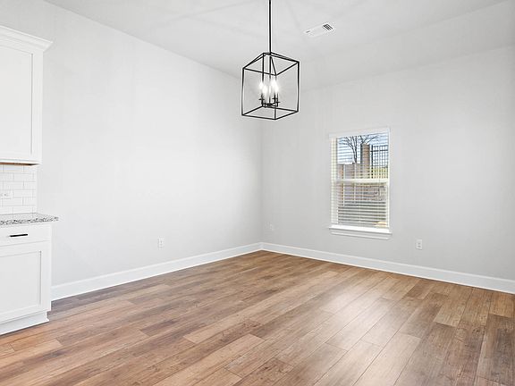 The dining room sits right off of the kitchen.