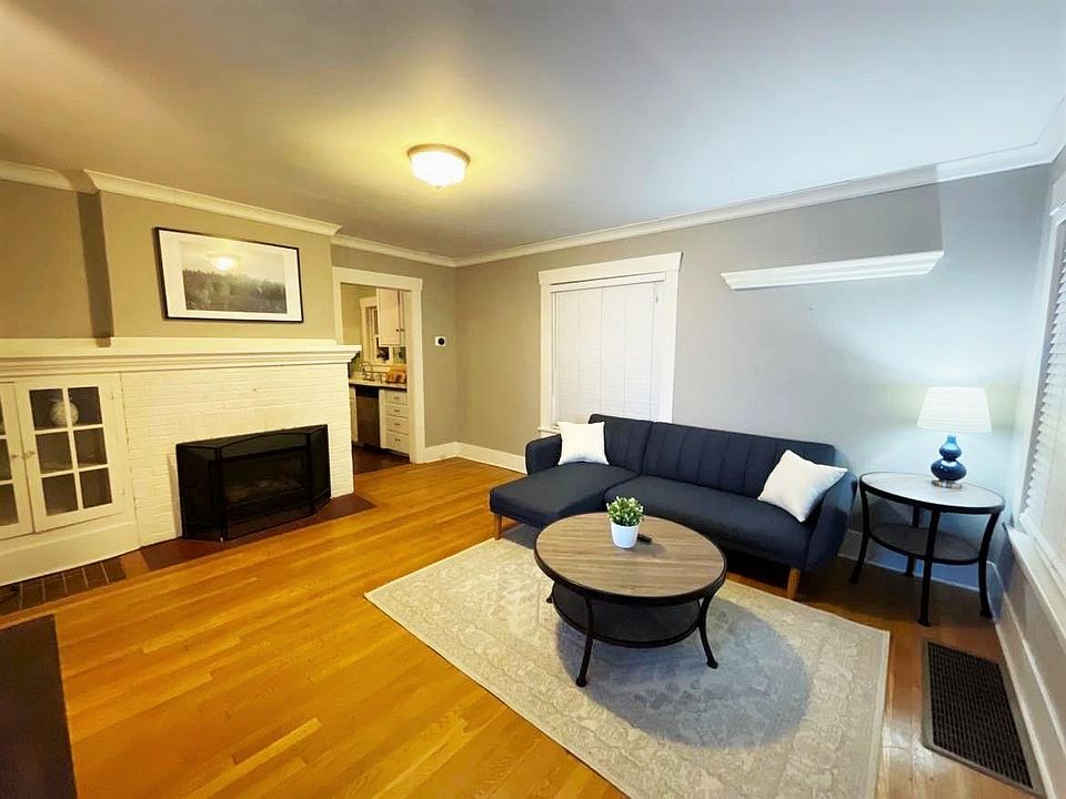 Spacious & cozy main living room with sleeper couch & fire place. Picture taken at night, but good sun light during the day with 2 big windows.