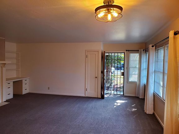 Looking at front door entrance with security screen door