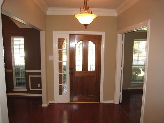 Harwood flooring flows through the entry, formal dining room, study, and family room!