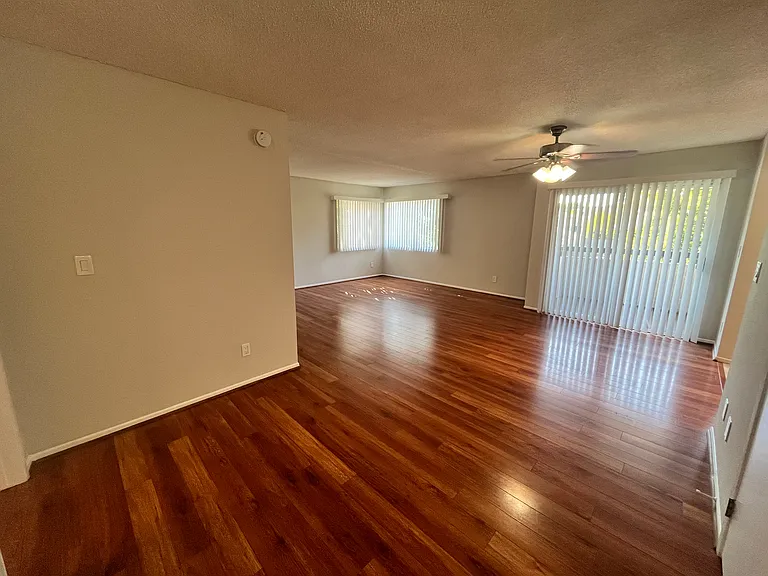 Large open concept living & dining space, with a private balcony