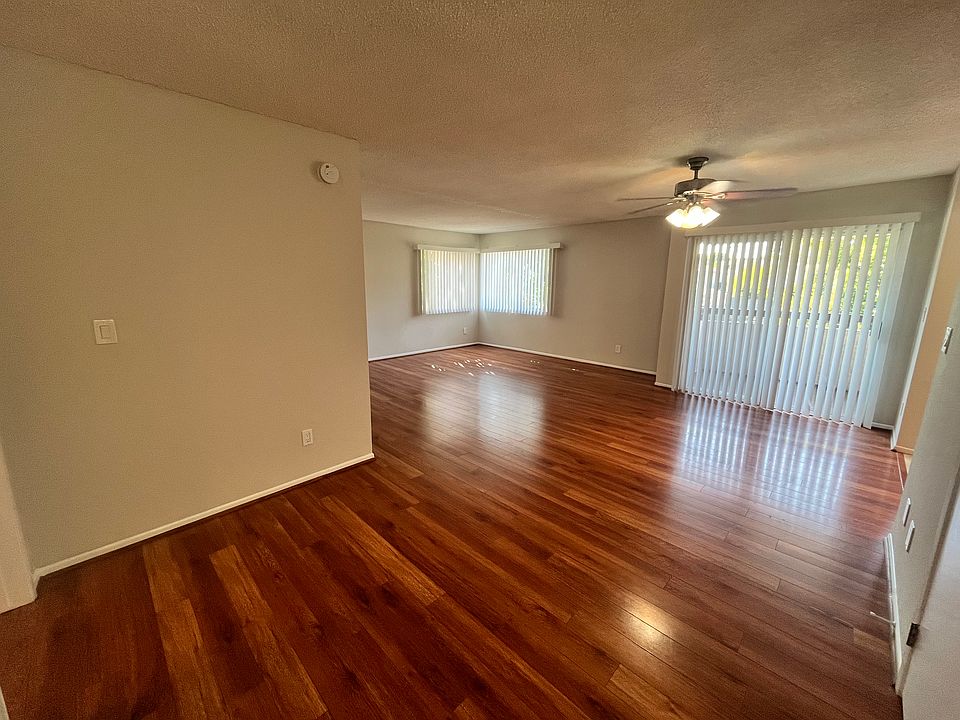 Large open concept living & dining space, with a private balcony